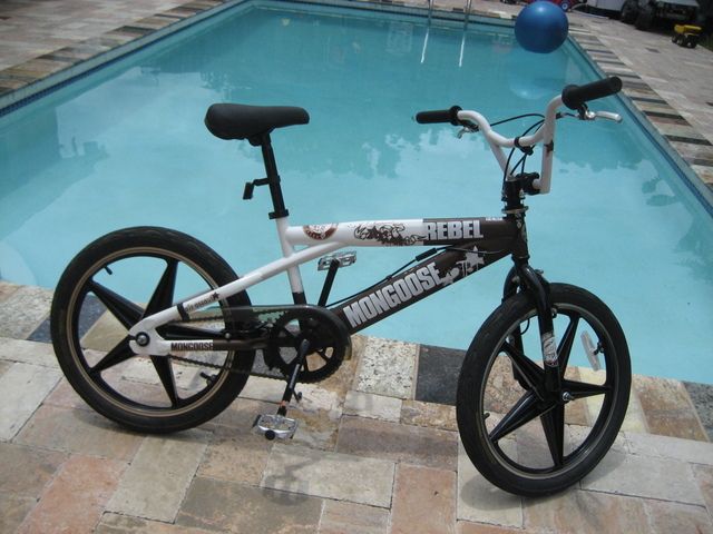 brown and white mongoose bmx bike