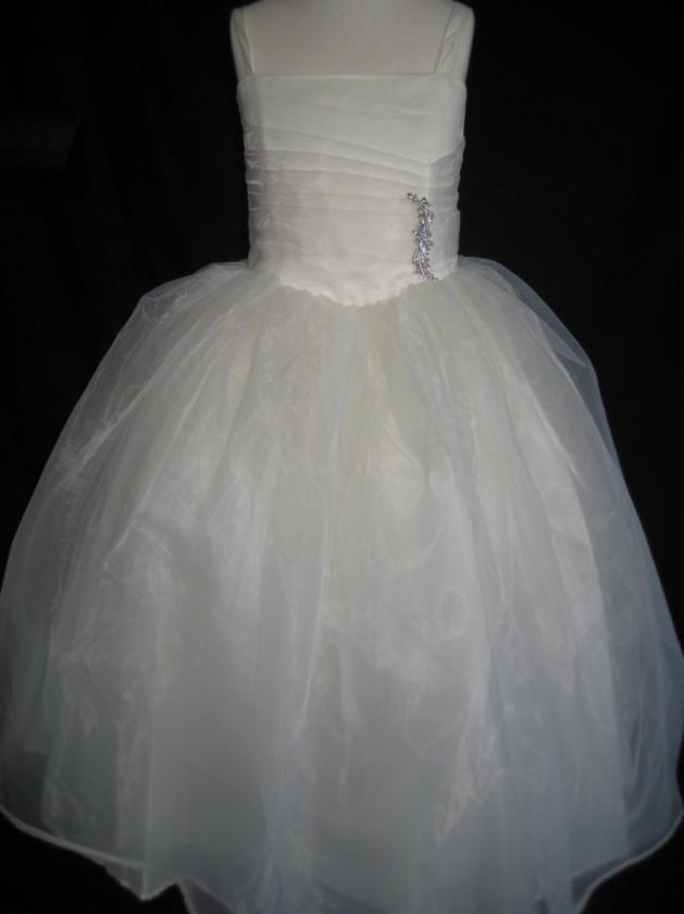   girl dress features a satin spaghetti strap bodice with a pleated