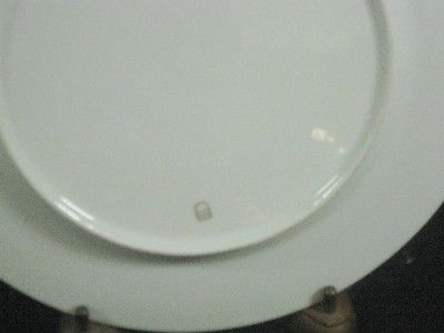 SET OF TWELVE GERMAN PORCELAIN PLATES WITH A MAKERS MARK OF A GOLD 