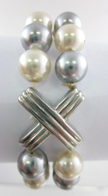 Cream Silver Tone Cross Bracelet. This is a beautiful piece of jewelry 